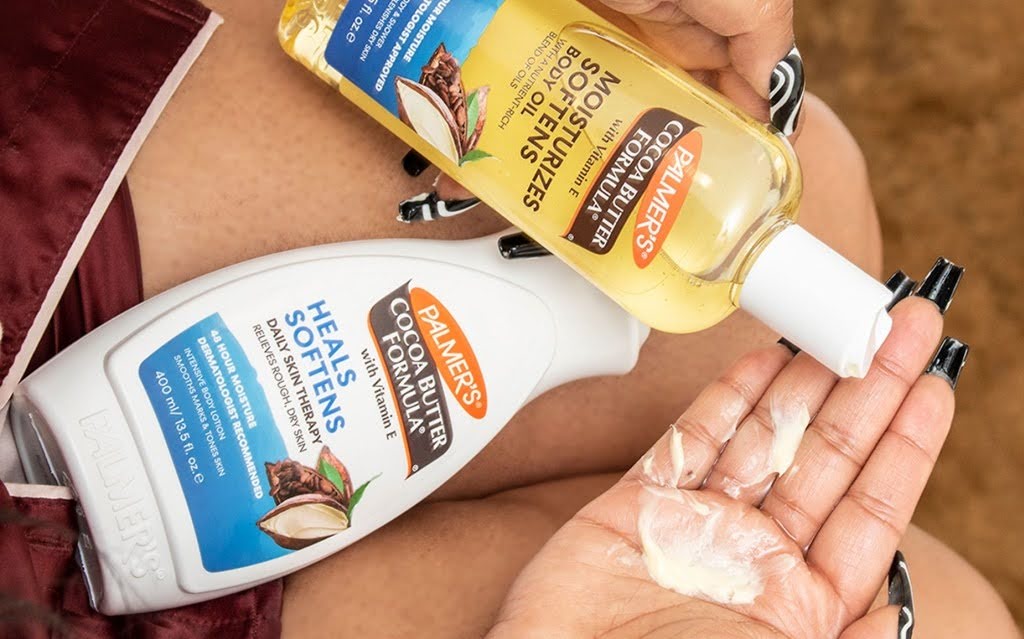 Woman using Palmer's Body Oil and Moisturiser