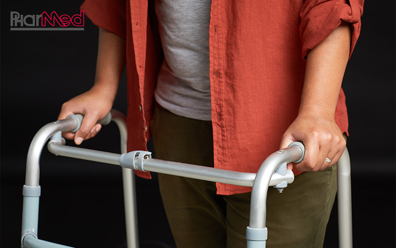 Close-up of a person using a walking aid.