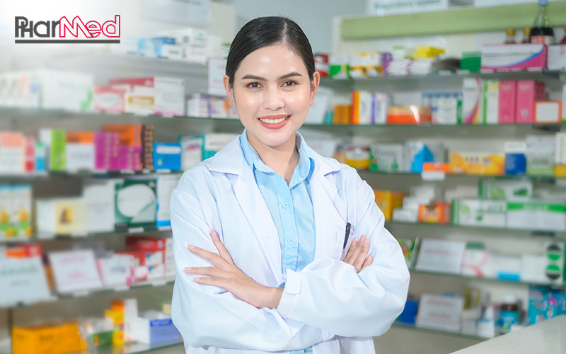 Pharmacist smiling, representing a reliable pharmaceutical distributor.