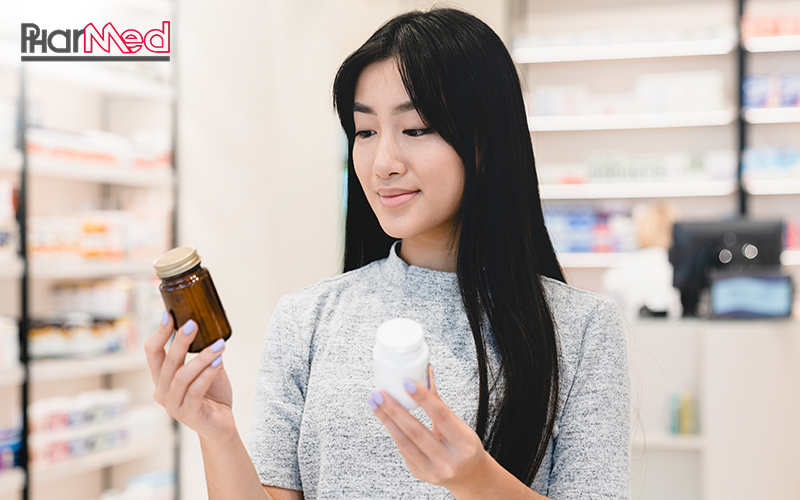 Woman choosing between nutraceutical products at Pharmed.