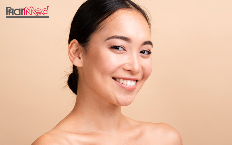 A happy young woman with healthy, glowing skin.