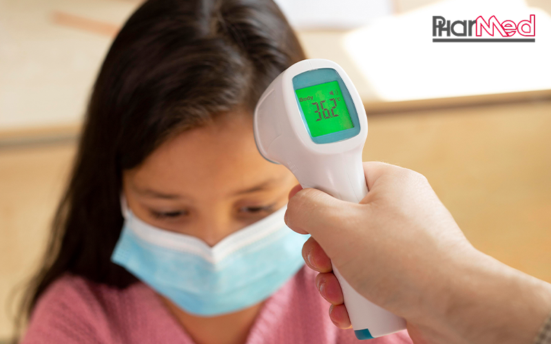 Checking a child's temperature with a non-contact thermometer.